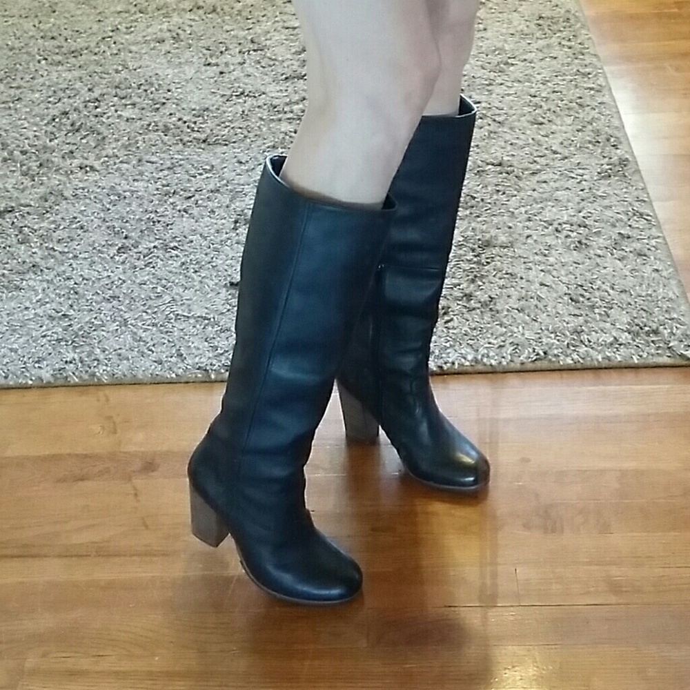 Black leather knee high heel boots